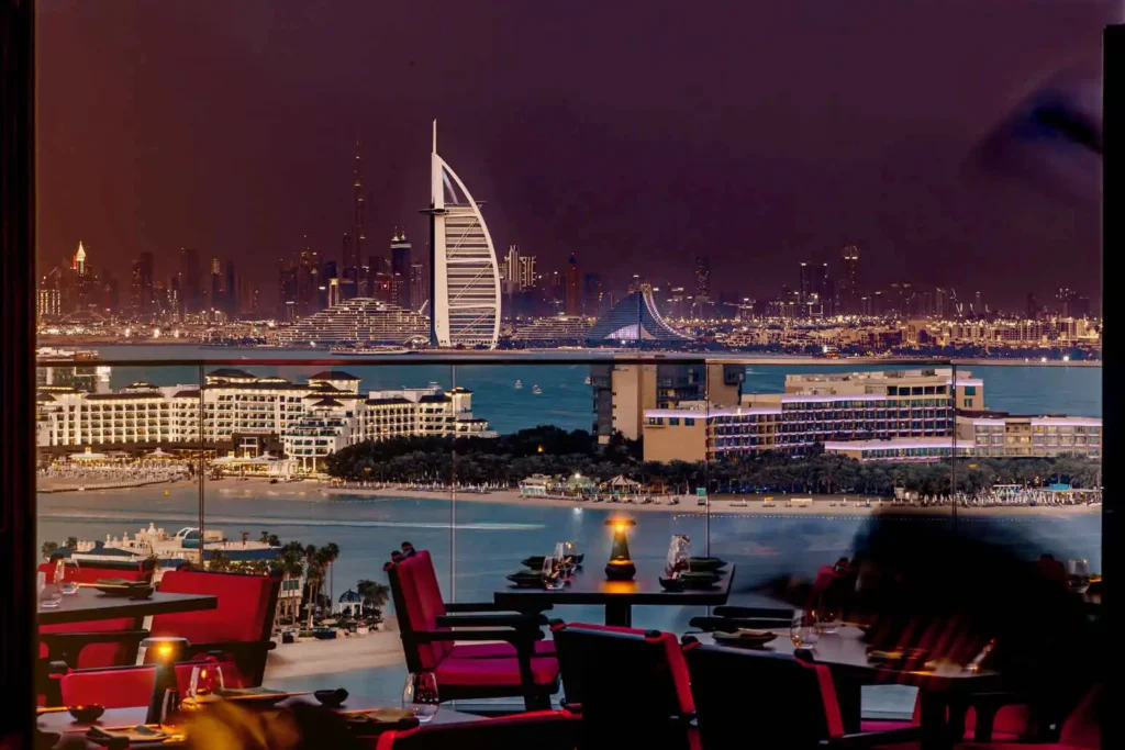 Vibrant dining area of Asia Asia Business Bay with urban Dubai views