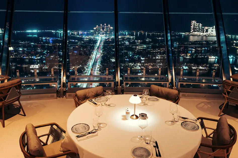 CouCou Dubai's stylish dining area on the 52nd floor overlooking Palm Jumeirah