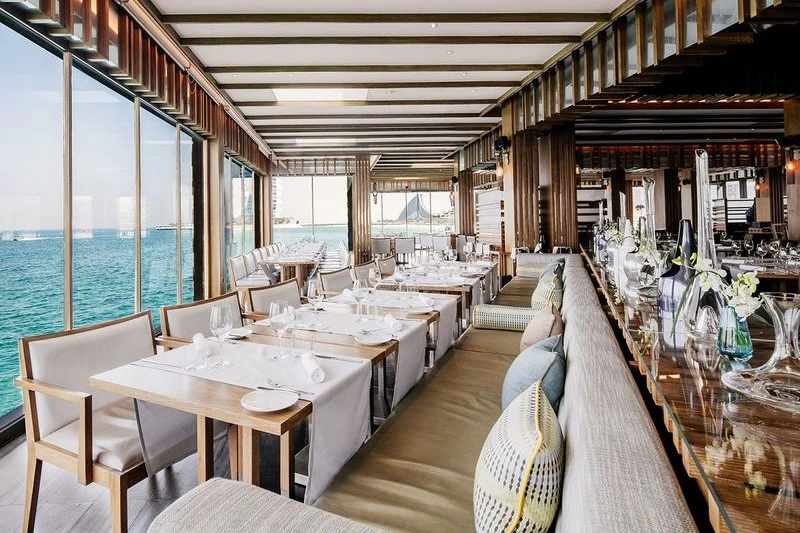Romantic waterside setting at Pierchic Dubai restaurant with a stunning view