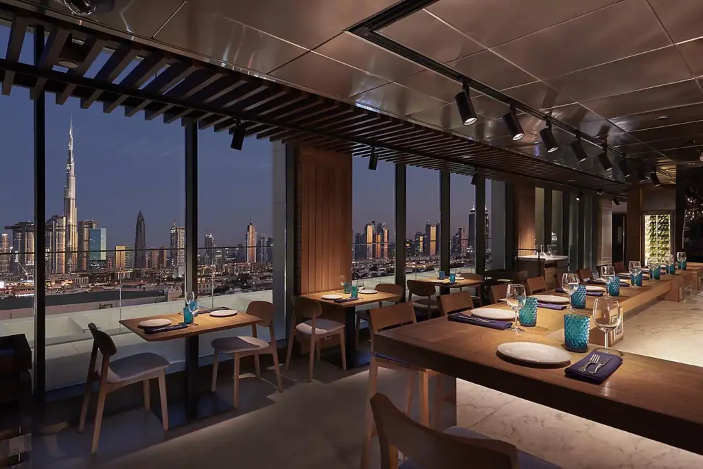 Tasca Dubai’s inviting interior with views of Dubai's coastline